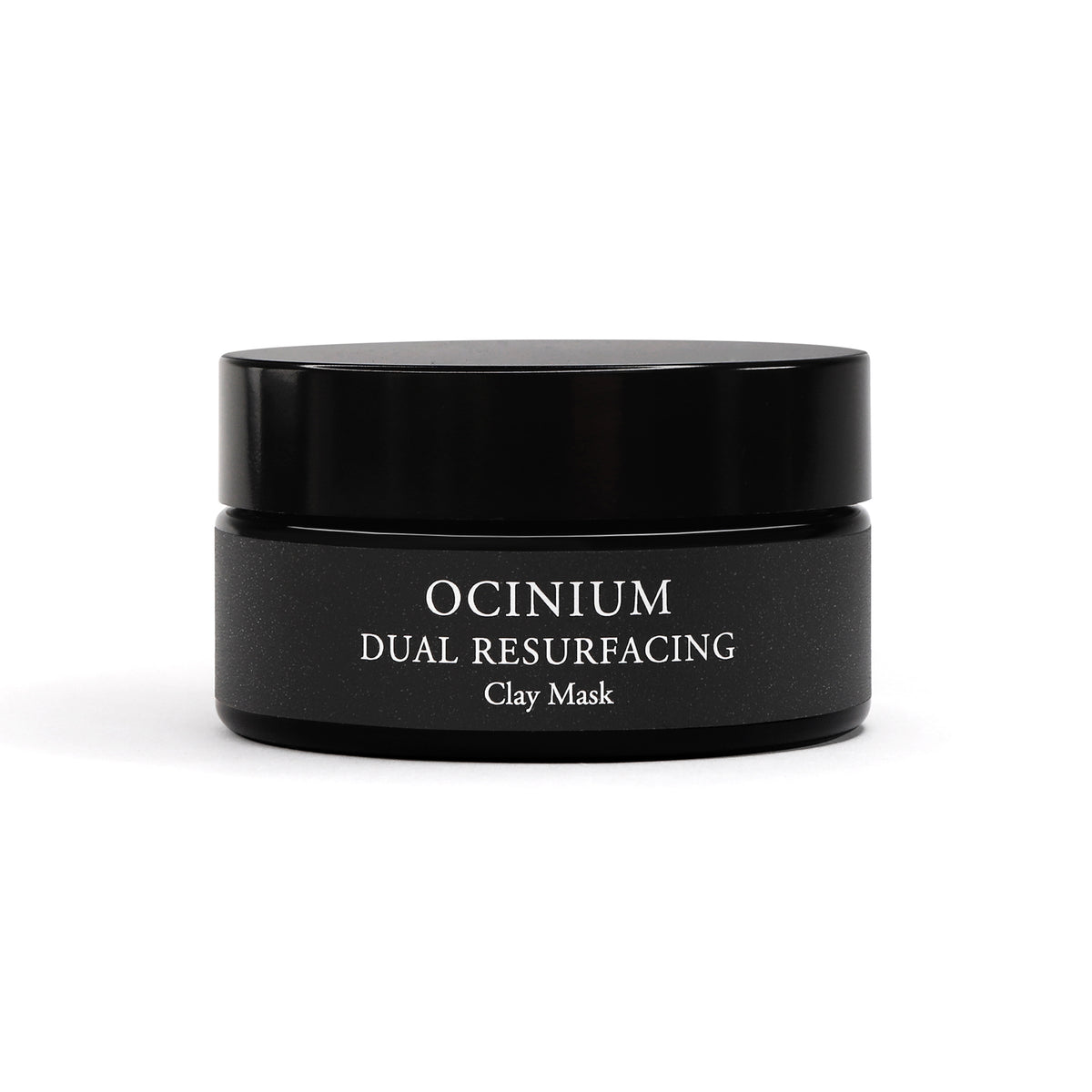Black jar of Ocinium Dual Resurfacing Clay Mask on a white background