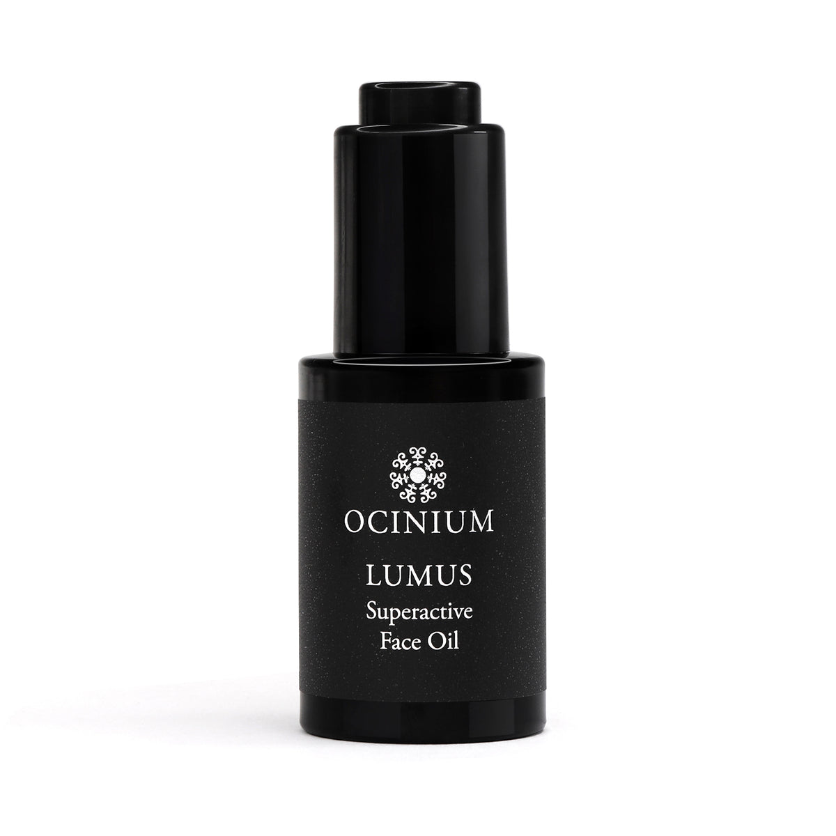 Black face oil bottle labeled 'Ocinium Lumus Superactive Face Oil' on a white background