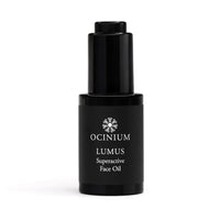 Black face oil bottle labeled 'Ocinium Lumus Superactive Face Oil' on a white background