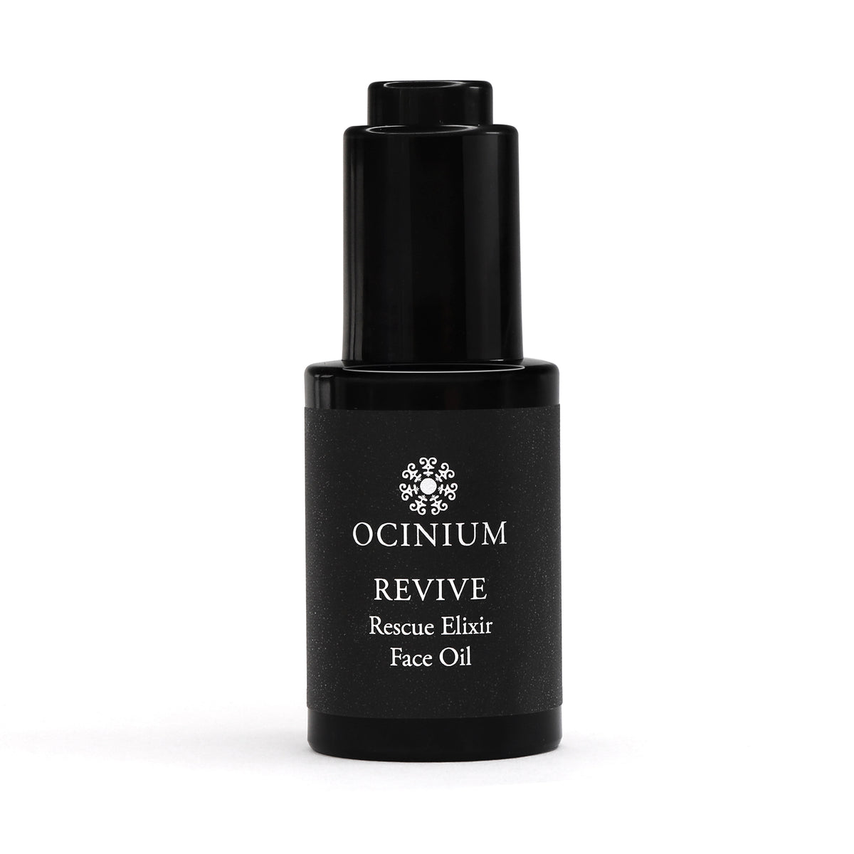 Black bottle of Ocinium Revive Rescue Elixir Face Oil on a white background