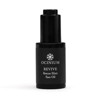Black bottle of Ocinium Revive Rescue Elixir Face Oil on a white background