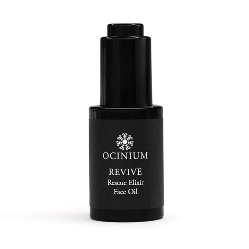 Black bottle of Ocinium Revive Rescue Elixir Face Oil on a white background