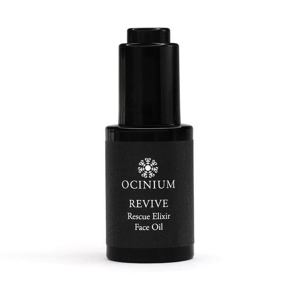 Black bottle of Ocinium Revive Rescue Elixir Face Oil on a white background